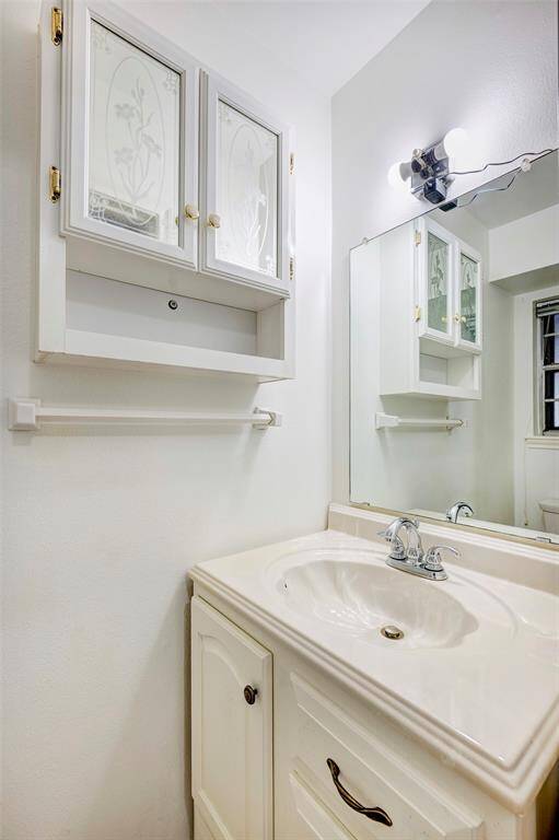 Half bathroom connected to the laundry room.