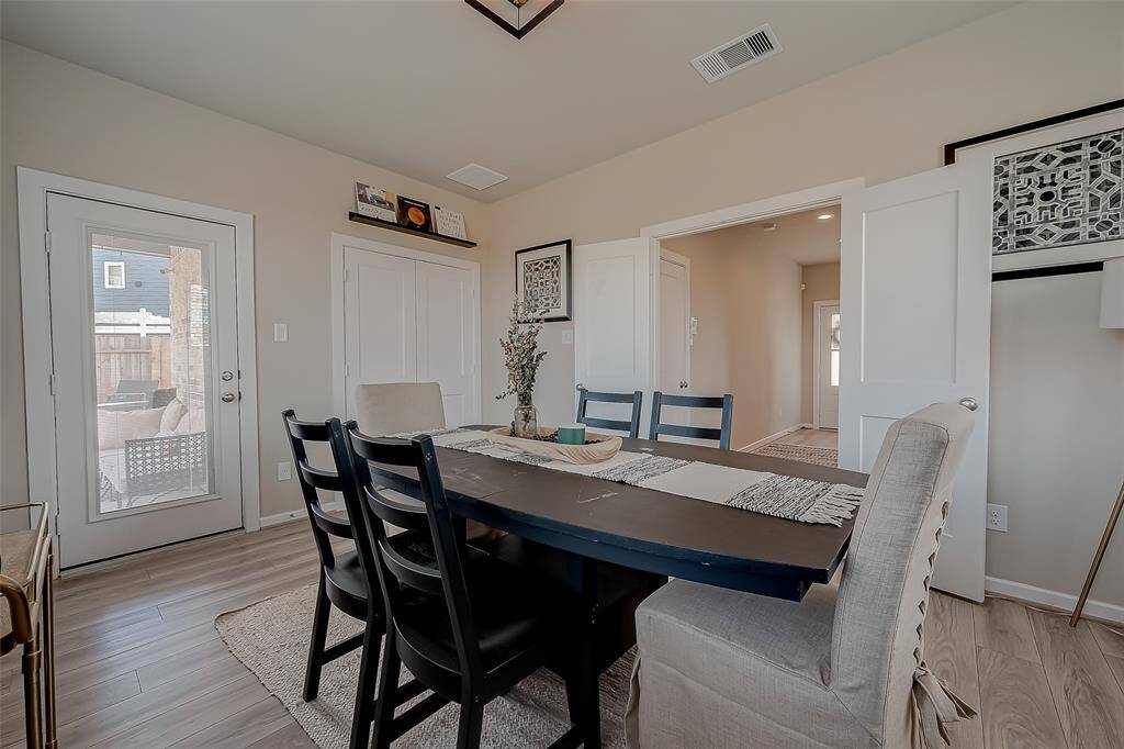 Step into this inviting family room/loft on the first floor of a stunning three-story home. Bathed in natural light from large windows with backyard views, the open-concept design seamlessly connects indoor and outdoor spaces. Elegant flooring, no carpet, and a versatile layout make it perfect for gatherings.