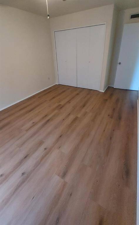 A Secondary Bedroom With Double Door Closet