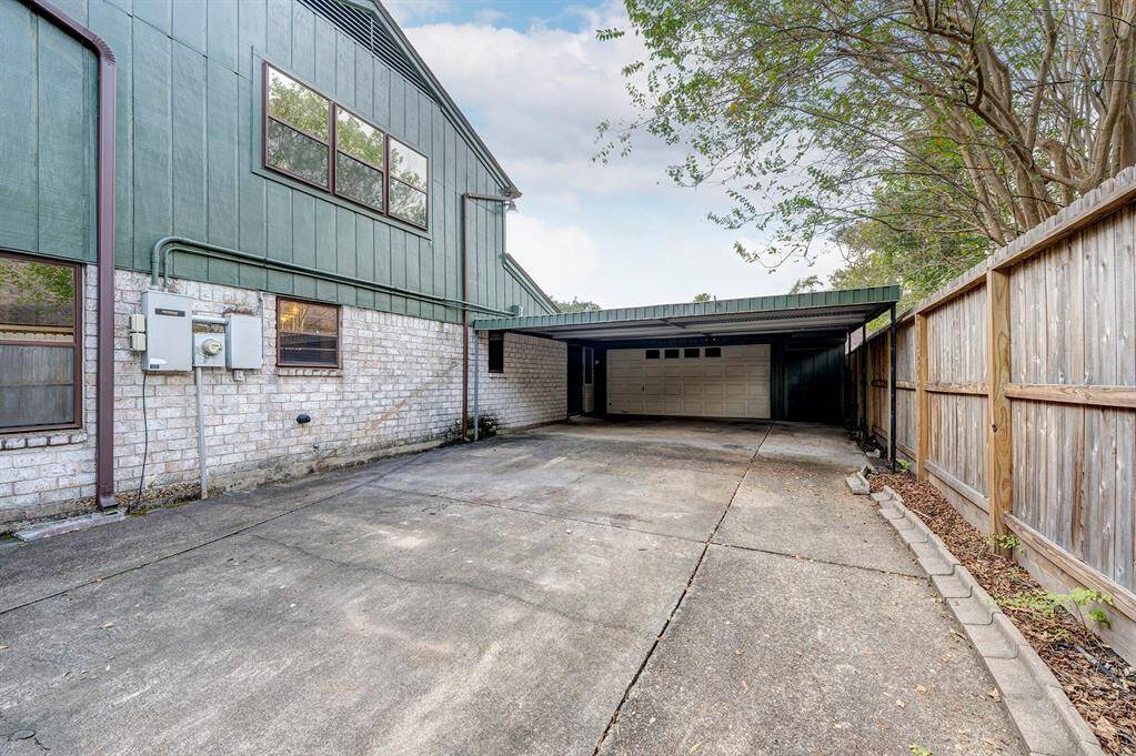 2 car garage, side storage space and 2 vehicle carport.