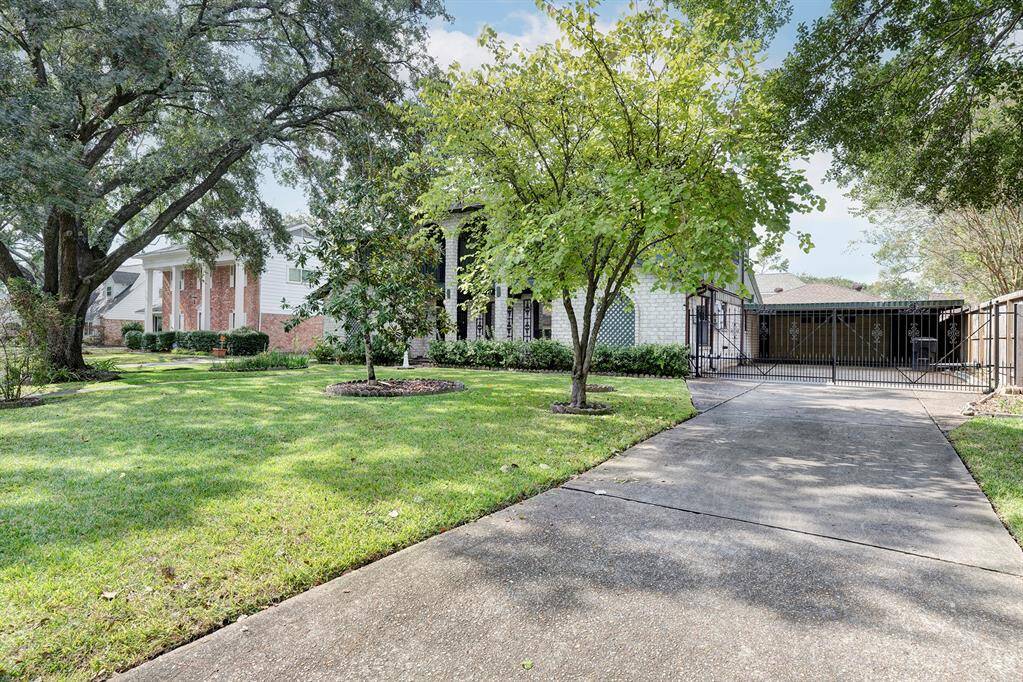 Driveway provides additional off-street parking in front and behind the automatic driveway gate.