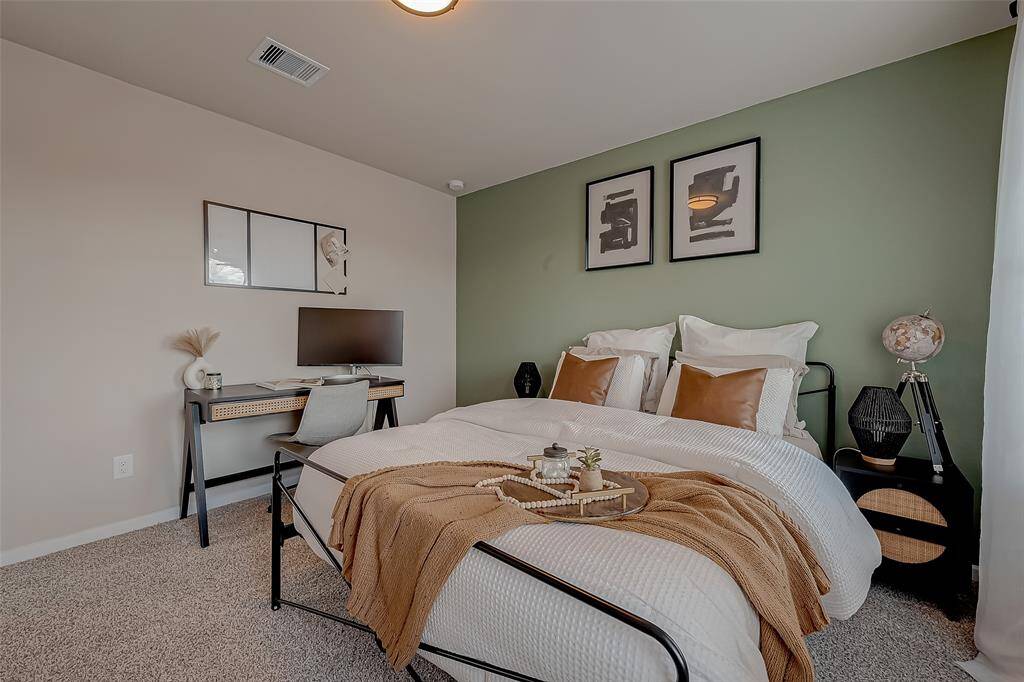 The second bedroom is generously sized and filled with natural light, creating a bright and inviting space. Its ample room offers flexibility for various uses, making it a comfortable and functional area for guests or family members.
