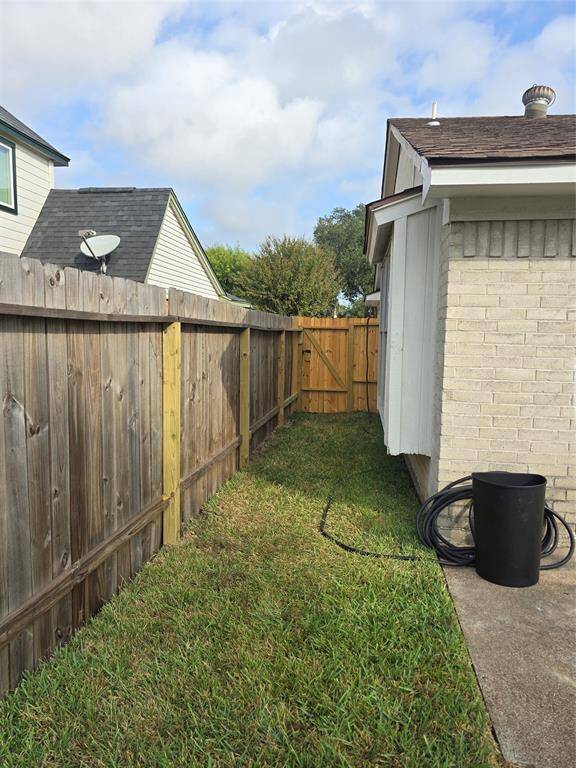 View of the side entrance to the backyard.