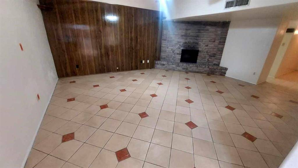Family Room has a Corner Fireplace. Ceramic Tile has Inlaid Accents