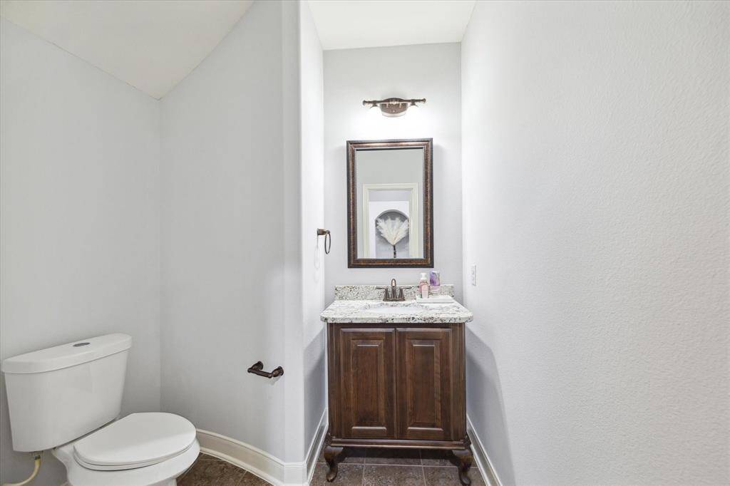 Take a look at the convenient half bathroom located on the first floor, ideally situated for guests. This well-appointed space offers both comfort and privacy, making it the perfect addition for entertaining or everyday living.