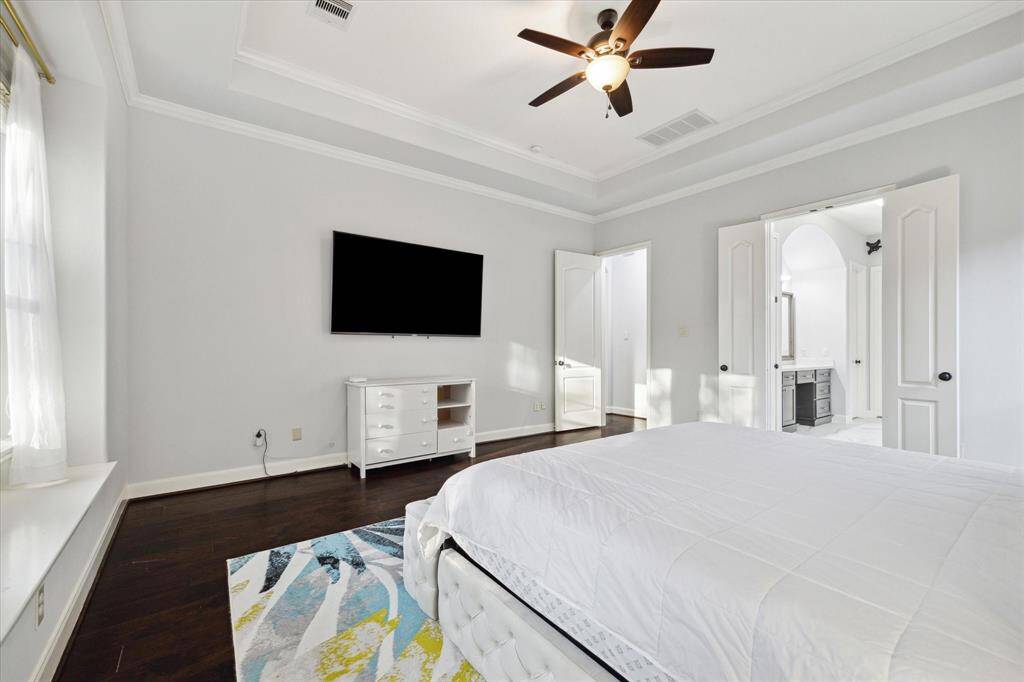 Step into the spacious primary retreat, conveniently located on the first floor. Featuring beautiful hardwood floors, window seat, along with a tray ceiling that creates a sense of depth and elegance.
