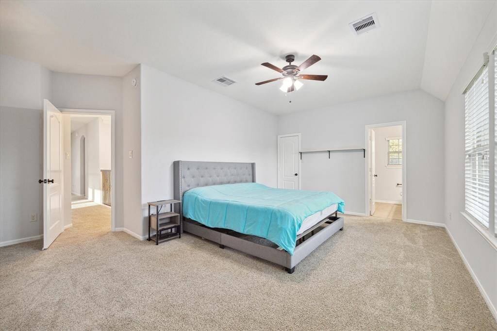 This well-appointed secondary bedroom offers privacy and convenience, complete with its own full en-suite bathroom.