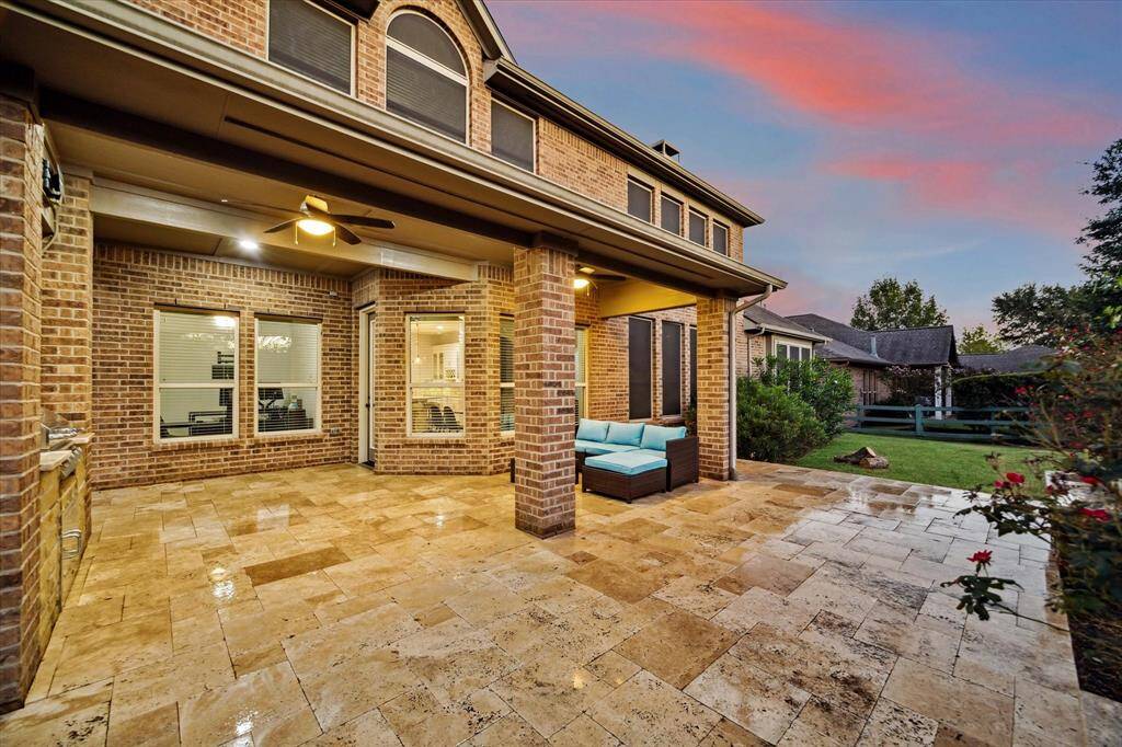 With the perfect amount of space for outdoor furniture, this area allows you to relax and enjoy the view of the expansive backyard, creating an ideal setting for outdoor living and entertaining.