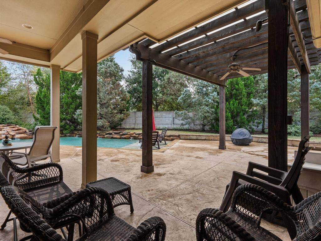 True Oasis, Featuring A Sparkling Pool With A Sun Ledge, and Pergola For Shaded Entertaining