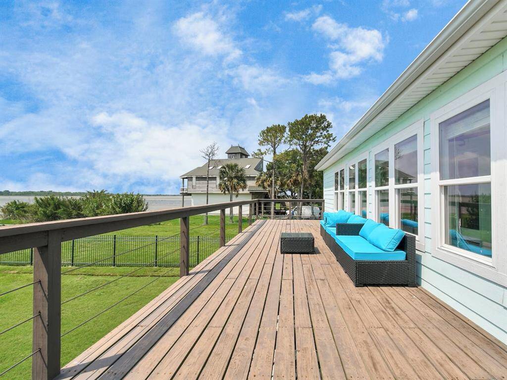 Expansive outdoor deck ideal for savoring your morning coffee while taking in stunning sunrise views, or unwinding in the evening with breathtaking sunsets over Galveston Bay.