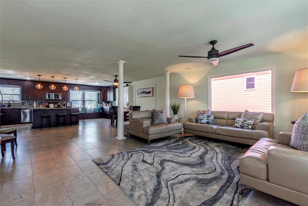 The expansive living room offers stunning bay views, creating an inviting space perfect for gatherings and relaxation.