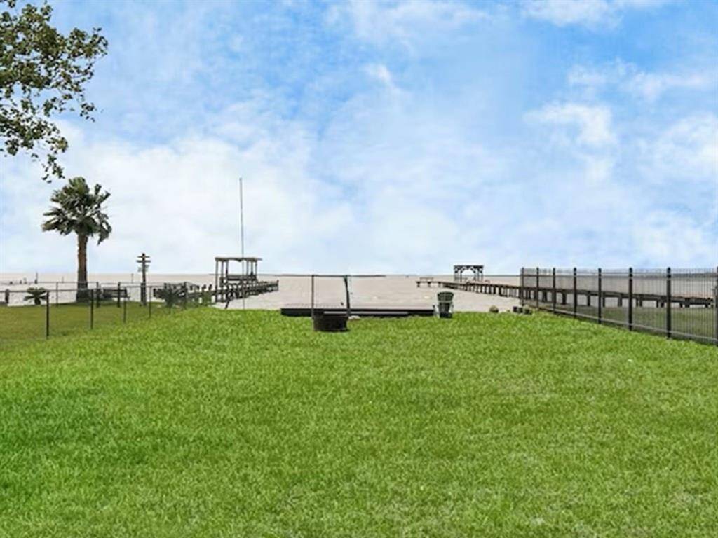 Enjoy the expansive yard and large deck at this scenic waterfront retreat, perfect for relaxation and taking in the views.