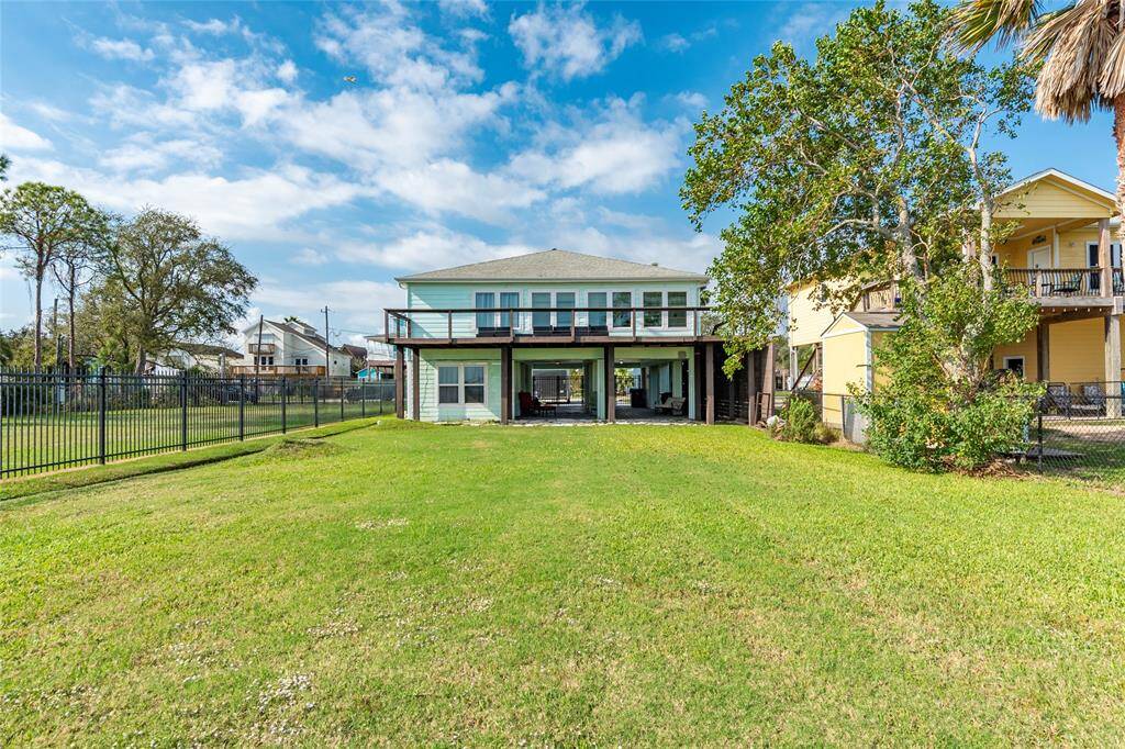 Enjoy lawn games, the refreshing bay breeze, and a relaxing barbecue while grilling and unwinding in the backyard.