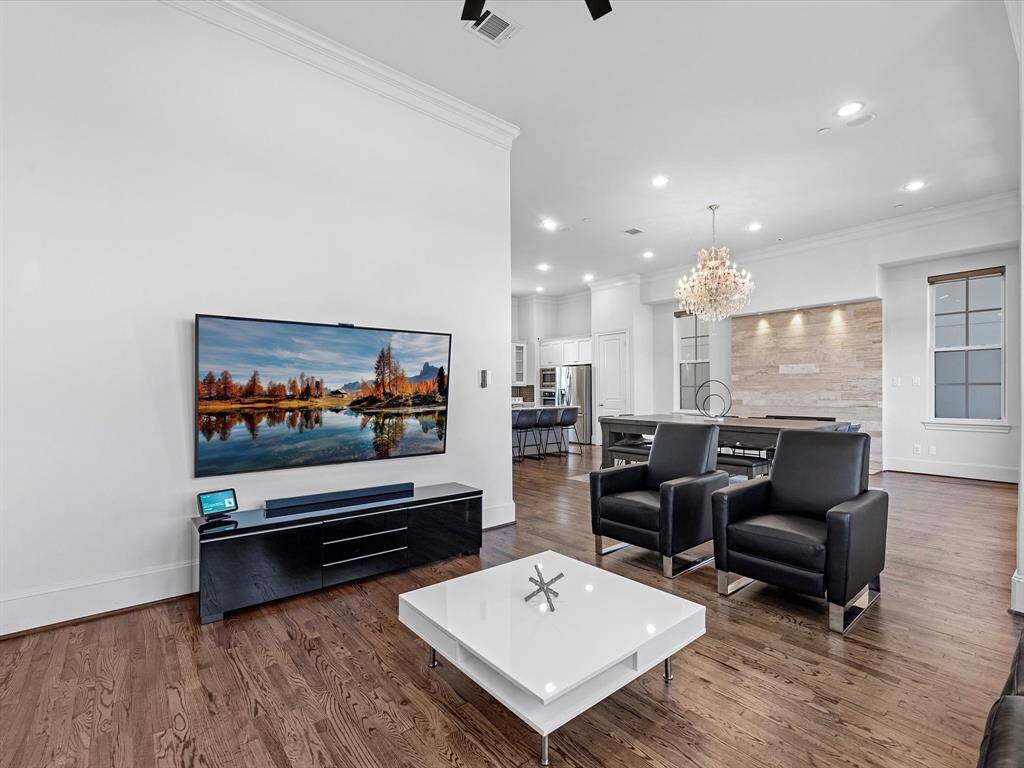 The home features expansive windows on every floor, offering breathtaking views of your lake while filling the space with abundant natural sunlight.