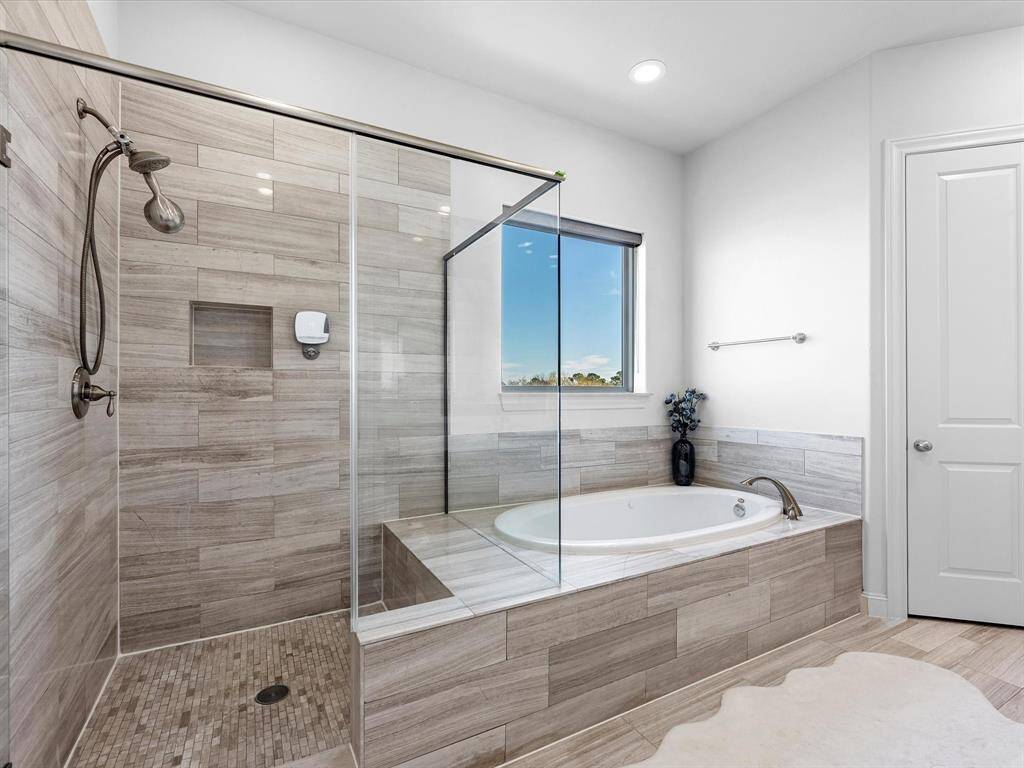 The fully upgraded en-suite bath offers a luxurious spa-like experience.