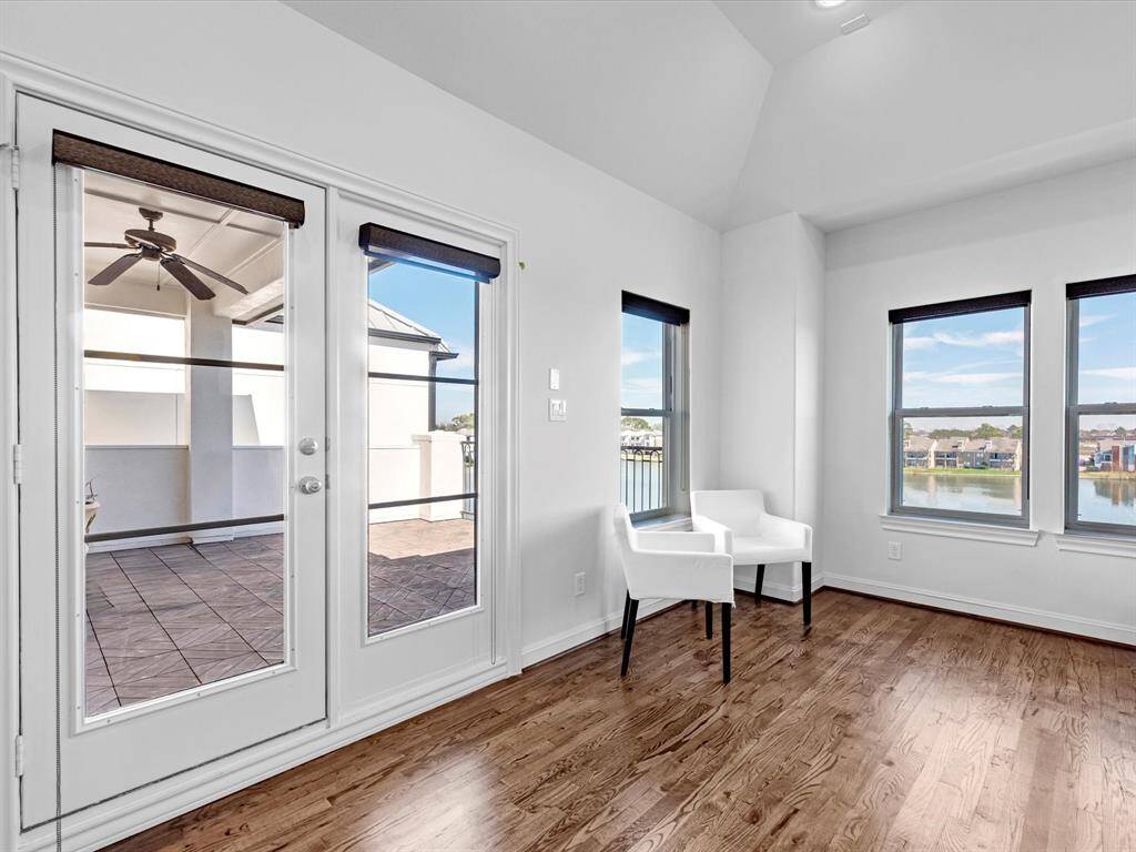 The fourth bedroom is generously sized, featuring three closets and a full en-suite bath. Currently used as an office, this versatile space can easily serve as a bedroom, game room, or flex space, with seamless indoor-outdoor access to your rooftop terrace.