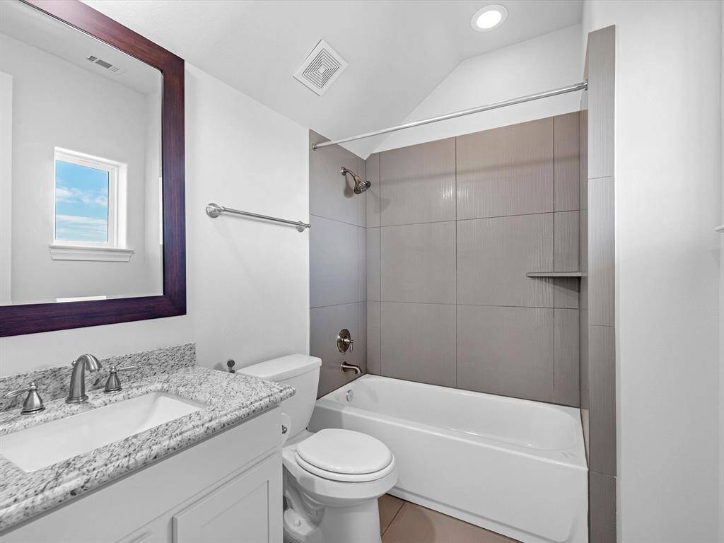 Full en-suite bath. 3 separate closets not pictured. Plenty of storage space in this functional home.