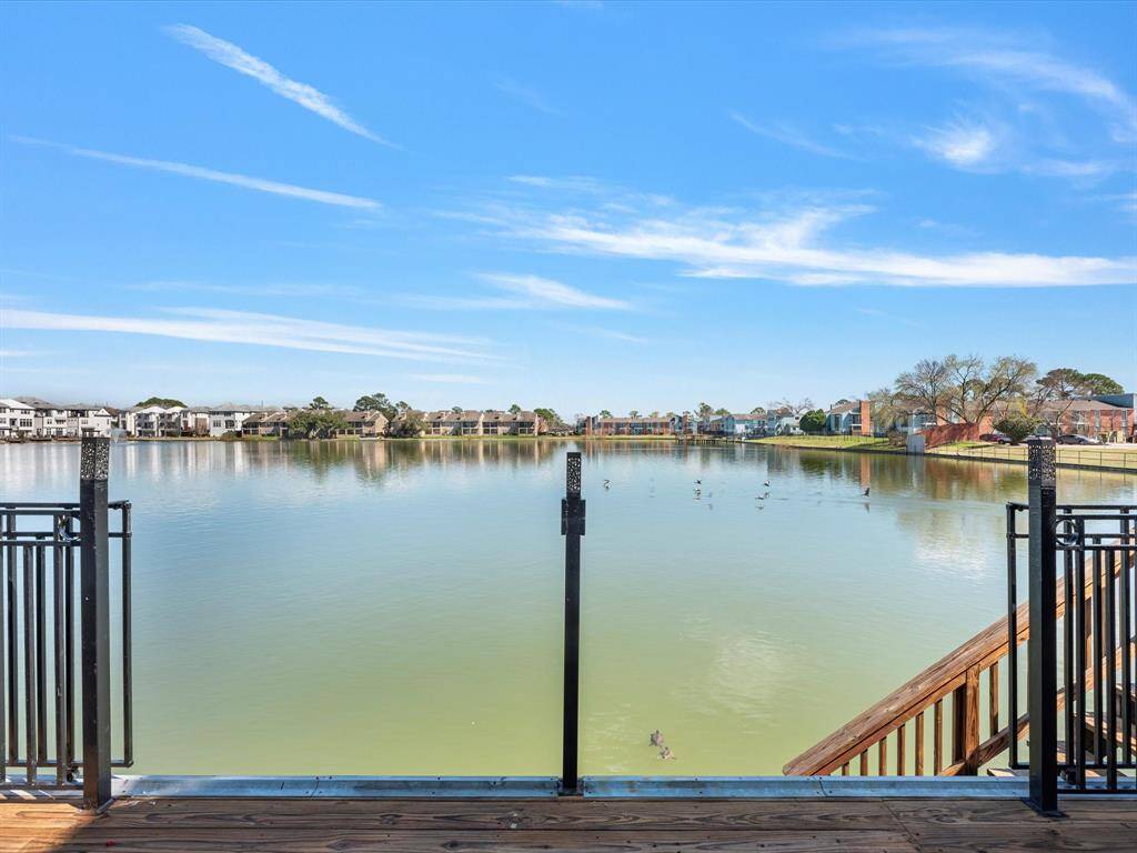 The fence opens easily, providing unobstructed views of the lake.