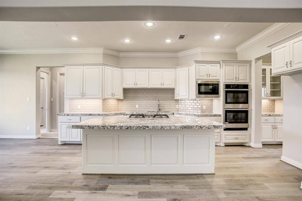 Another view of the kitchen showing under cabinet lighting.