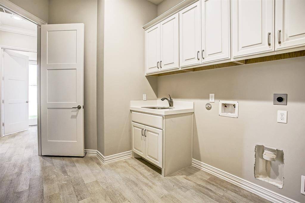 Game room with wood flooring and large hallway to the rooms & balcony