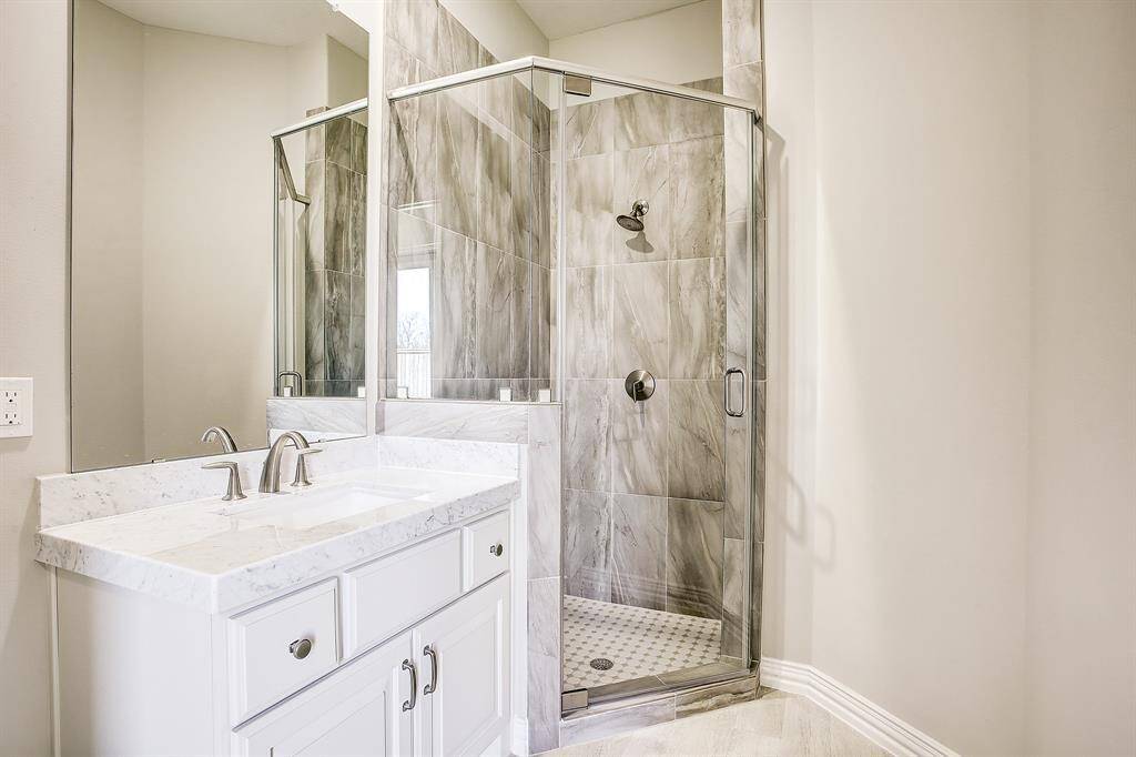 Bedroom #3 with large walk-in closets and private bathroom with standing shower.