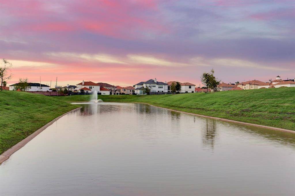 Recreation area with large community pool and spa.