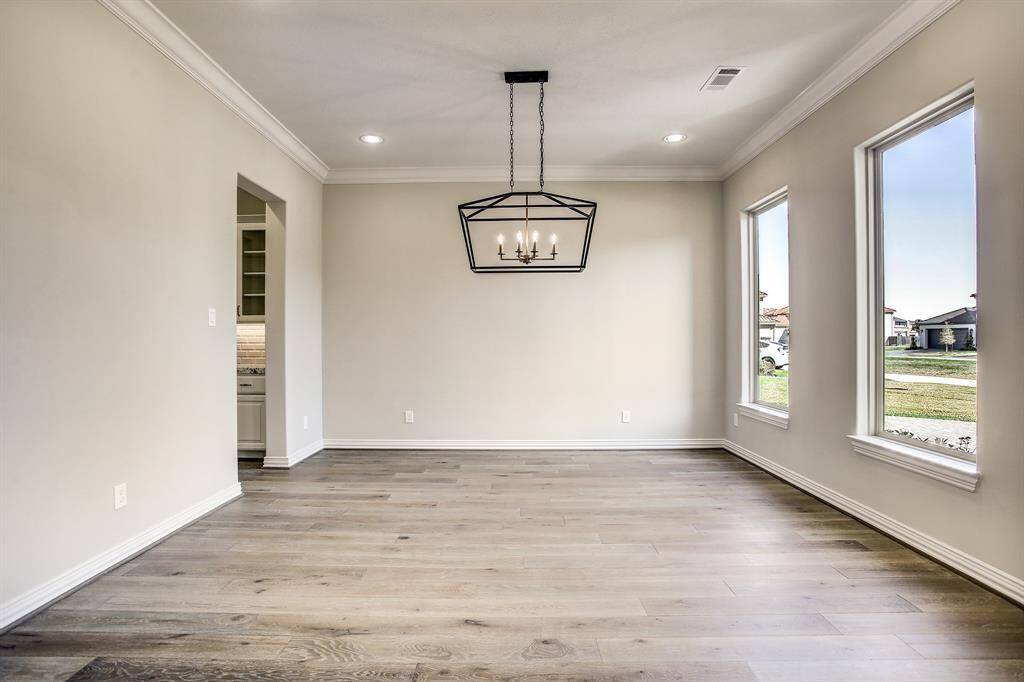 Beautiful wood flooring through out the house and open floor plan.