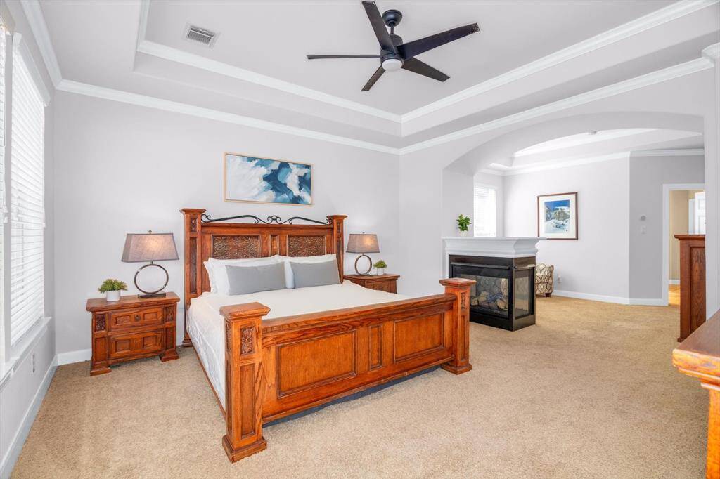 Wow!  Look at the size of this suite.  Gas fireplace, sitting area and large master bath.  The window on the left overlooks the backyard, and the other bedrooms are up so there is plenty of privacy here.