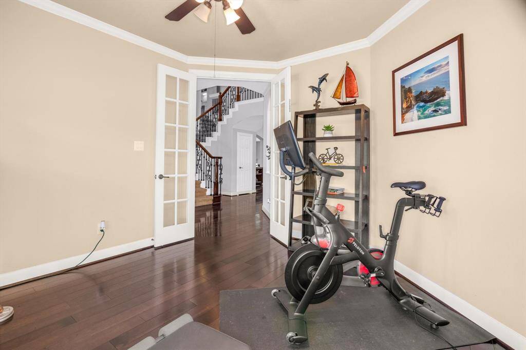 Nice french doors.  Now we will head upstairs.  The layout up is amazing.  The stairs divert left and right at a landing.  On one side is a gameroom, bedroom and full bath allowing for a COMPLETE GUEST SUITE.  In the other direction are the two other bedrooms with a Hollywood bath between them