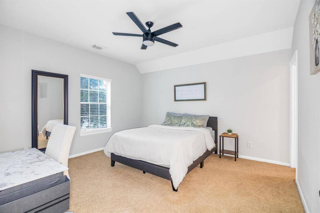 Same bedroom - notice the size of these secondary bedrooms - AND they all have walk in closets!  Upstairs bedroom 1 - guest suite bedroom