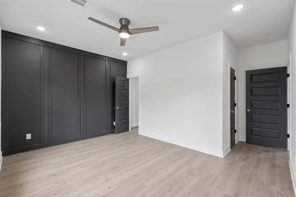 View of bathroom entrance in primary bedroom. *photos are from builders previous model home with same layout and fixtures*
