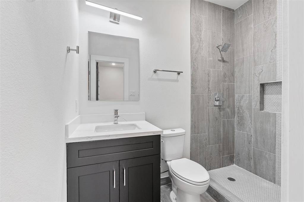 Primary bathroom with stand up shower. *photos are from builders previous model home with same layout and fixtures*
