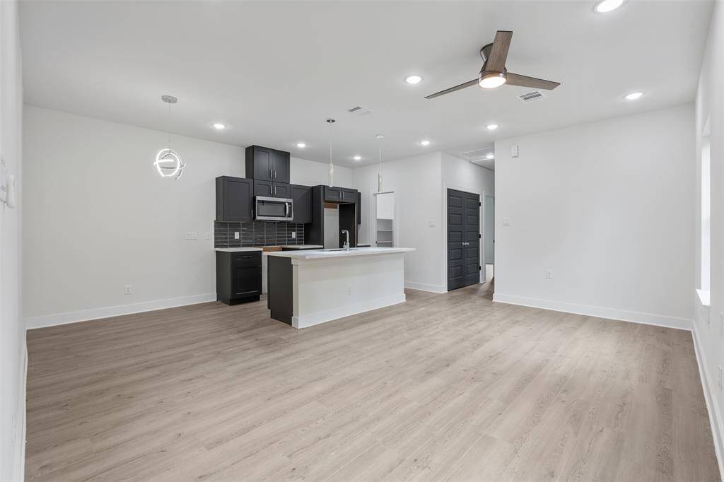 View of living area. *photos are from builders previous model home with same layout and fixtures*
