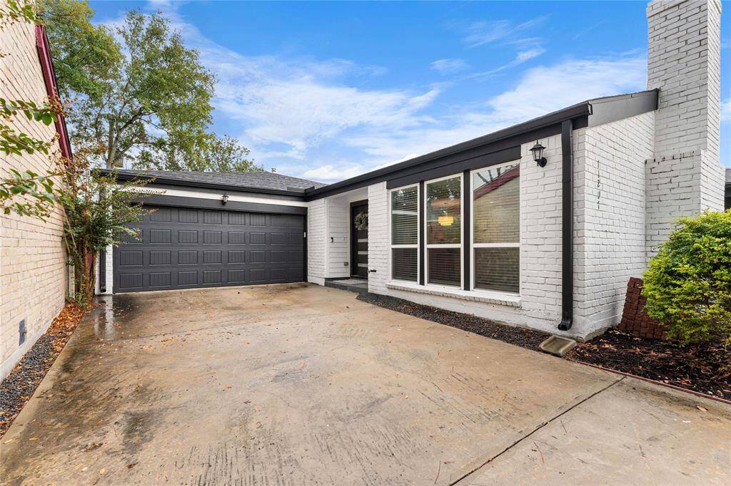 Clean, modern curb appeal with private driveway and 2-car garage.
