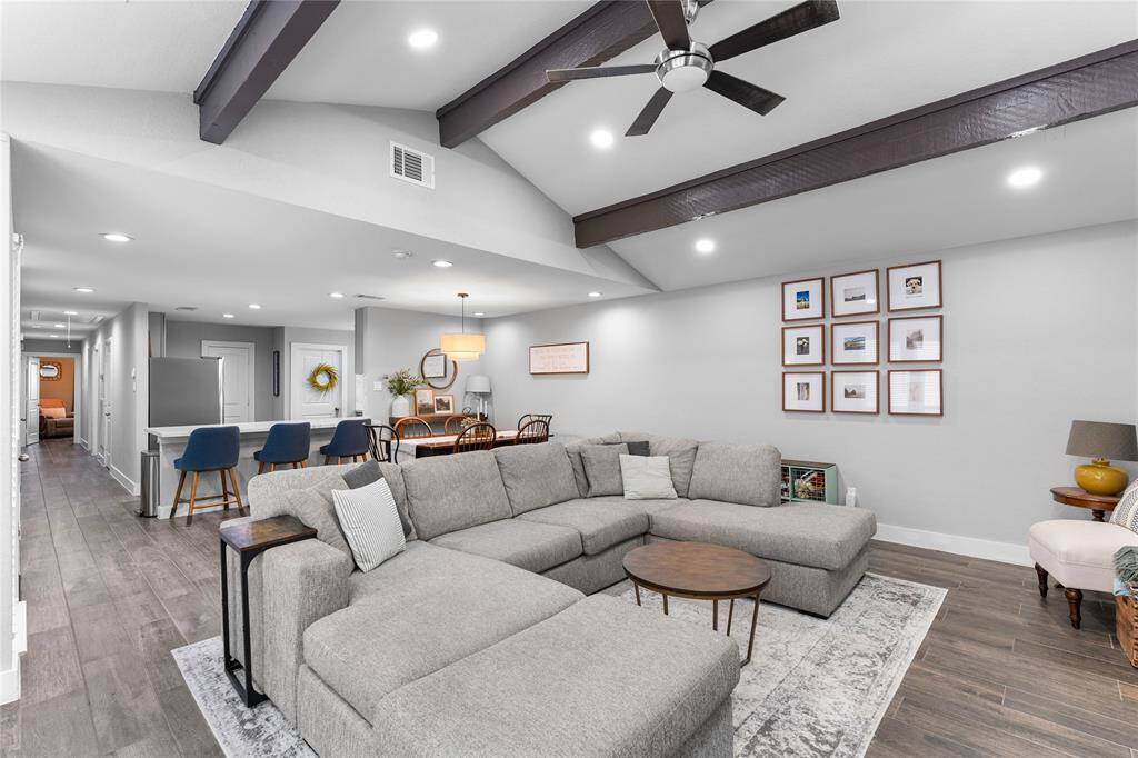 Seamless flow between living, dining, and kitchen.
