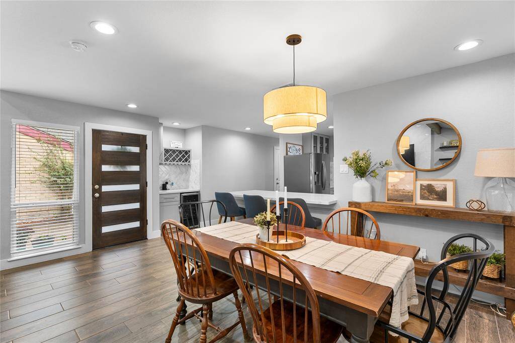 Stylish space, bar area w/ built in wine racks & wine fridge.