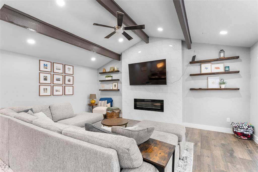 Cozy living room with beamed ceilings.