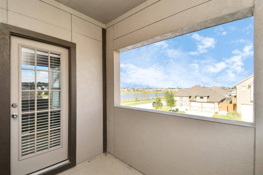 The covered balcony space is a unique feature for a secondary bedroom, and offers family or guests a private escape for outdoor relaxation!