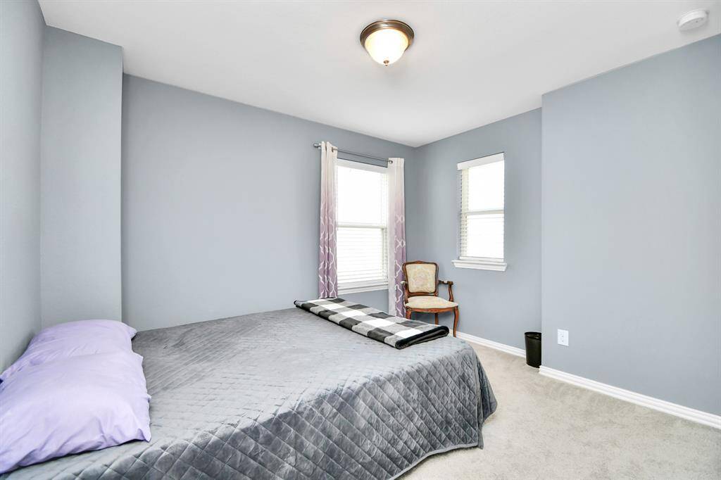 Another wonderful secondary bedroom, this one is filled with lovely natural light that enhances the room’s welcoming and peaceful feel!