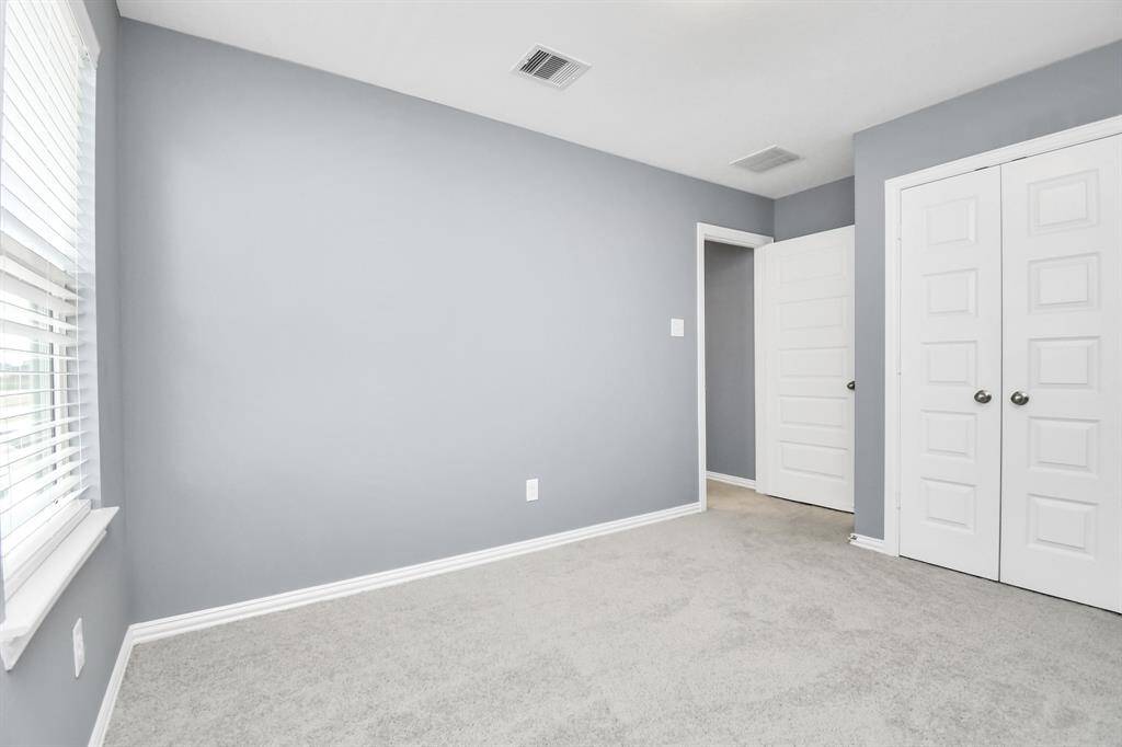 Here's another view of the fourth bedroom which shows the double-door closet space!