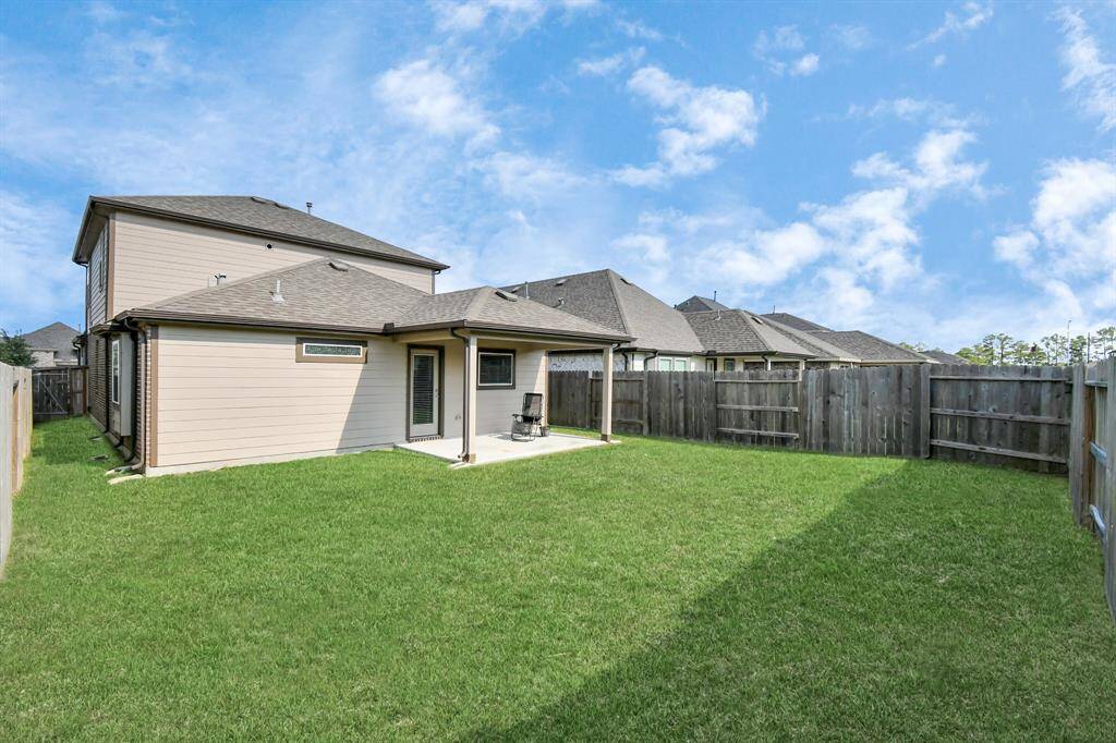 We absolutely love the spacious backyard, complete with a covered patio - ideal for outdoor grilling, entertaining or play!