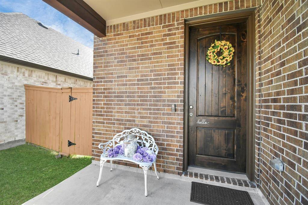 You're sure to enjoy the lovely covered front porch with a cozy seating area - perfect for relaxing and enjoying the neighborhood ambiance!