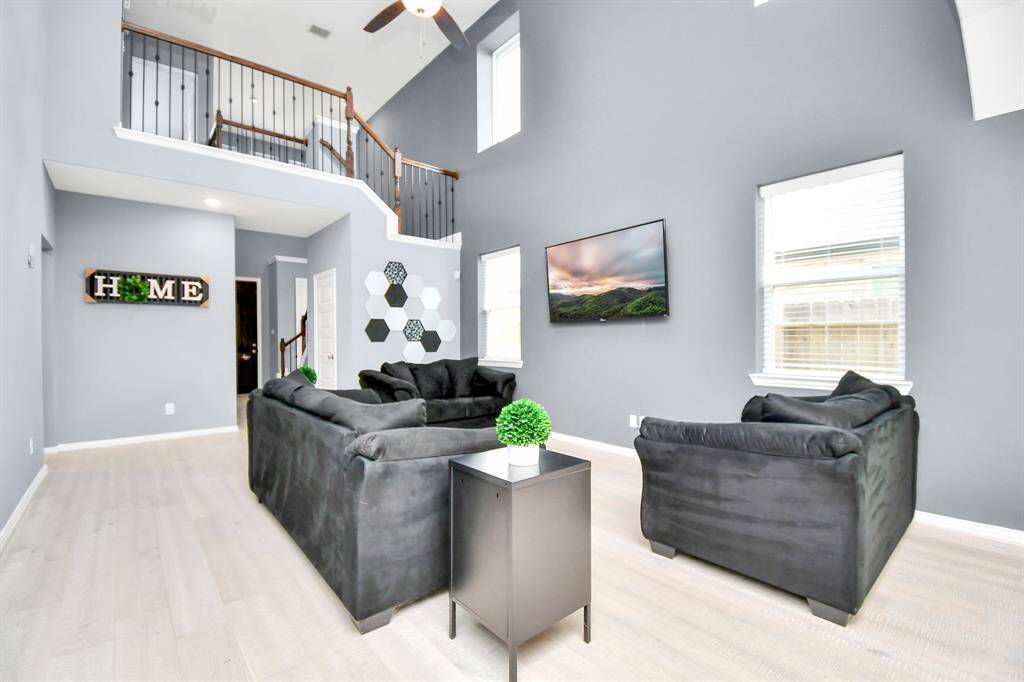The living area is ideal for both relaxation and entertaining, and its open layout and natural light make it a welcoming space!