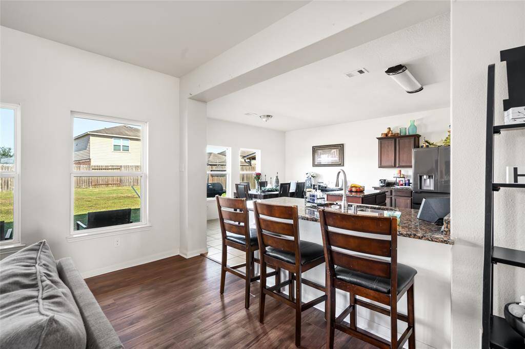This home features a free-flowing, open-concept floor plan, where the living room seamlessly transitions into the kitchen, and the kitchen to the dining area. The spacious layout fosters a sense of connectivity, perfect for entertaining, family gatherings, and everyday living.