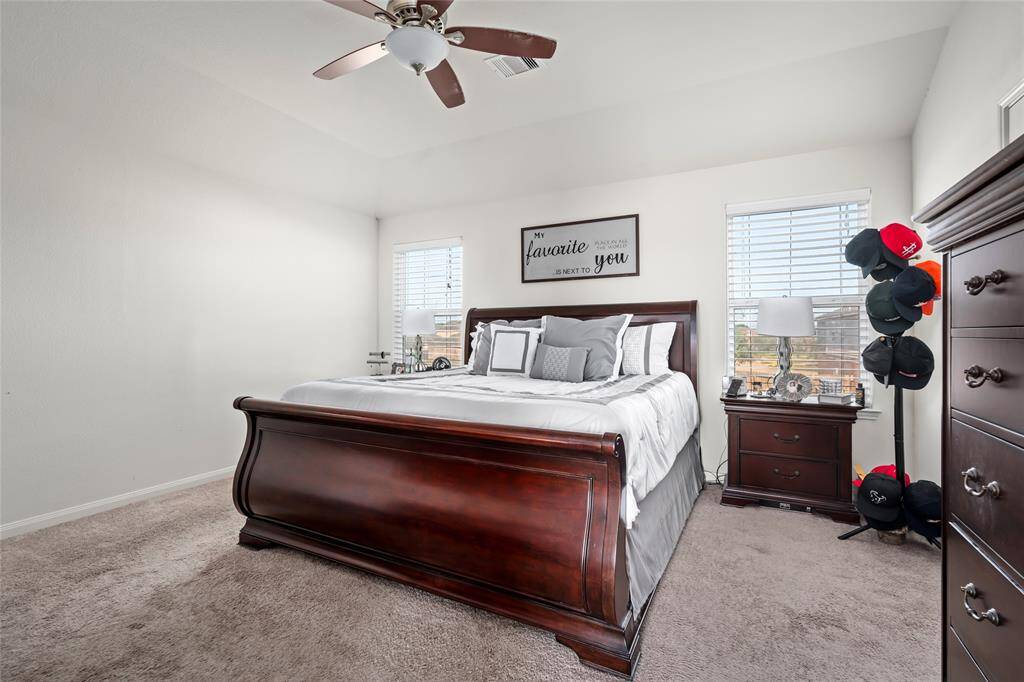 The spacious primary bedroom is a peaceful retreat, offering plenty of room to relax and unwind. With large windows that invite natural light, it features a serene atmosphere, a generous closet, and ample space for your personal touch.