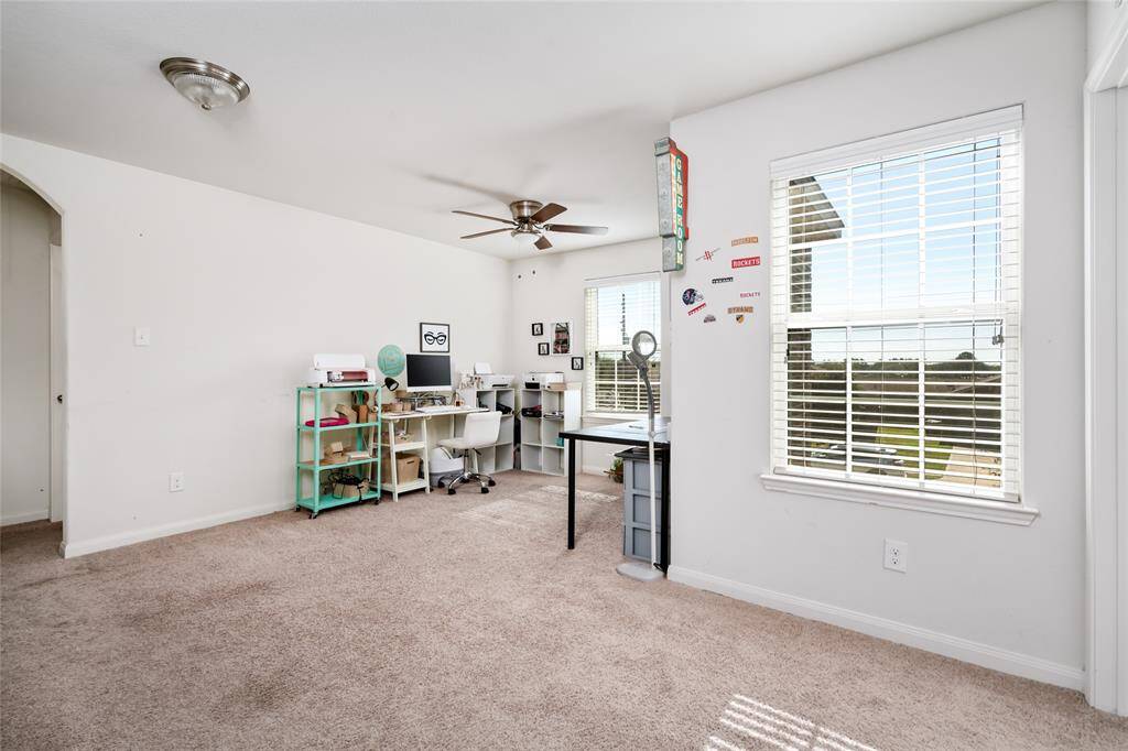 This vibrant game room is the perfect space for fun and entertainment, featuring plenty of room for games, activities, and relaxation. With ample space for seating and play, it's an ideal spot for family nights or hosting friends.
