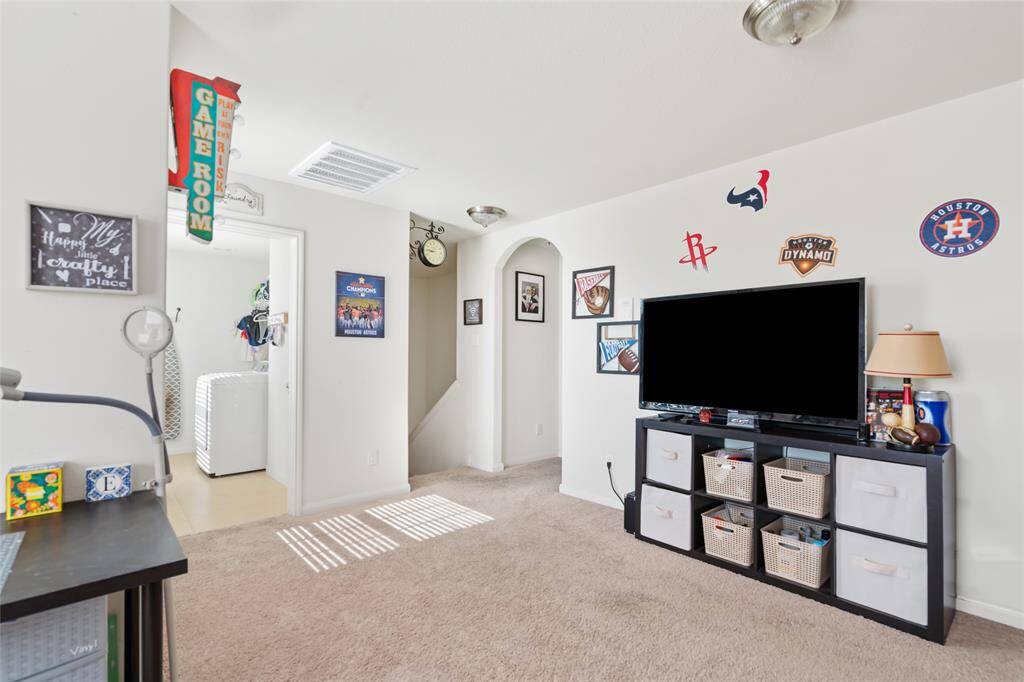 This spacious game room offers a lively atmosphere for both entertainment and relaxation. With room for games, a media center, or a play area, it’s the perfect spot to unwind and have fun with family and friends.