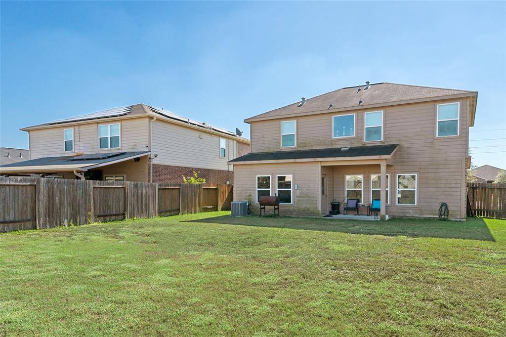 This backyard offers a peaceful retreat with ample room for outdoor dining, gardening, or play. Surrounded by greenery, it’s a versatile space where you can relax, entertain guests, or enjoy quiet moments in nature.