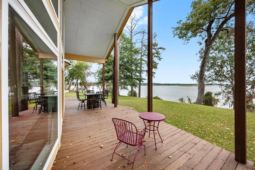 Back of home overlooking waterfront.  The expansive deck is ideal for entertaining family and friends.