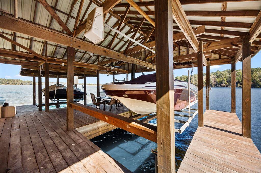 The current homeowner is conveying both the boat and jet skis as part of a non-realty package to prospective buyers.  Please contact the listing agent for additional information.